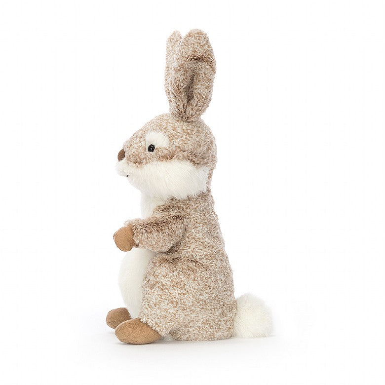 Adorable cuddly oatmeal jellycat bunny with long upright ears sitting on his back legs. 